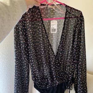 Floral bodysuit size medium new with tags